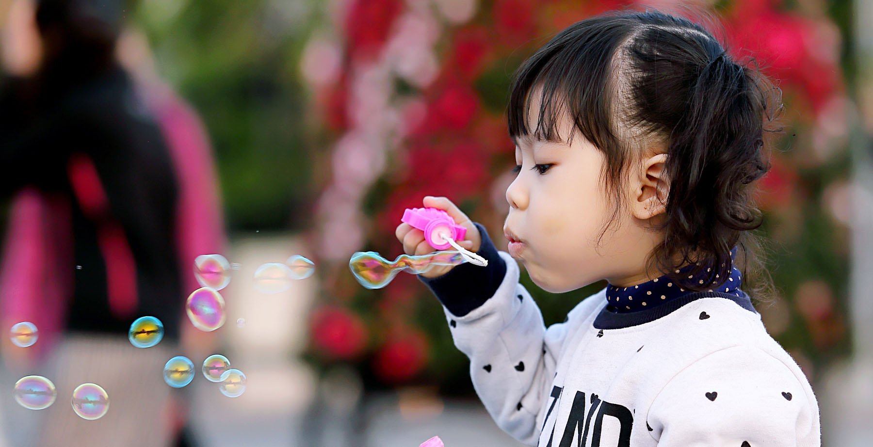 Little girl blowing bubble