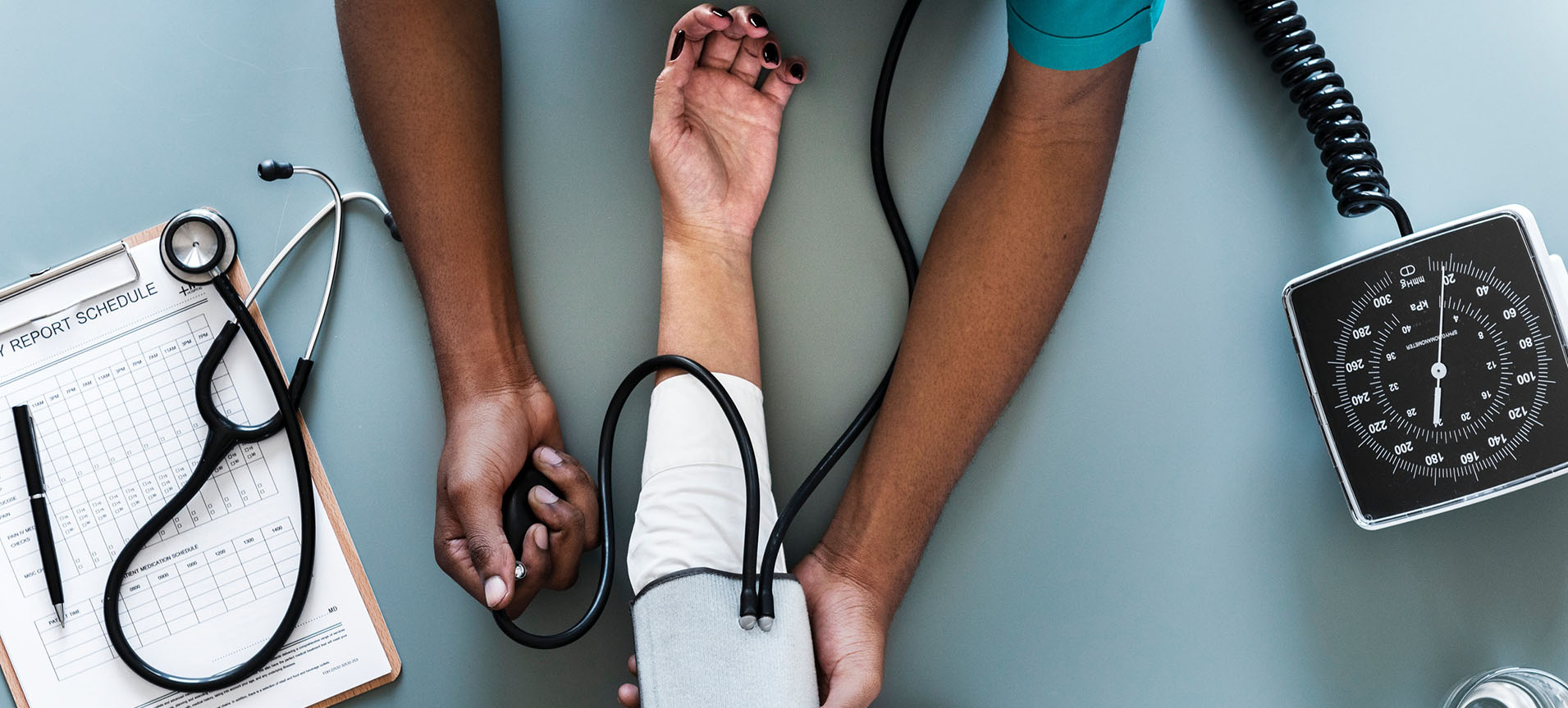 A patient is having their blood pressure taken.