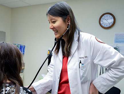 Resident consults with a patient